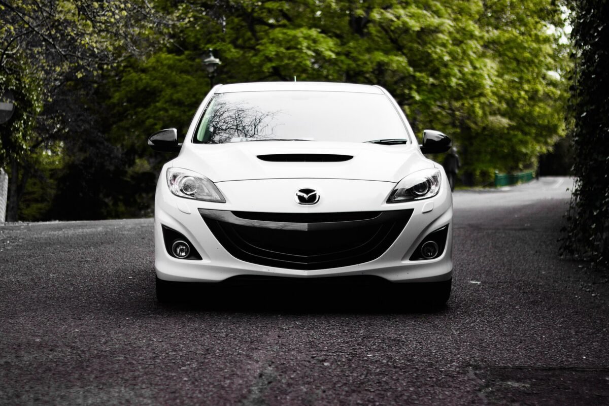Clean white Mazda after a hand car wash