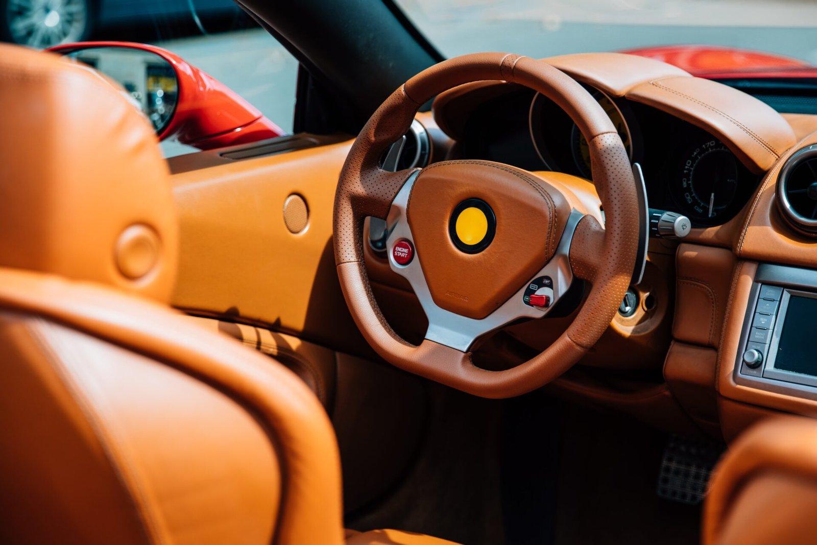 Tan leather steering wheel and seats after interior detailing