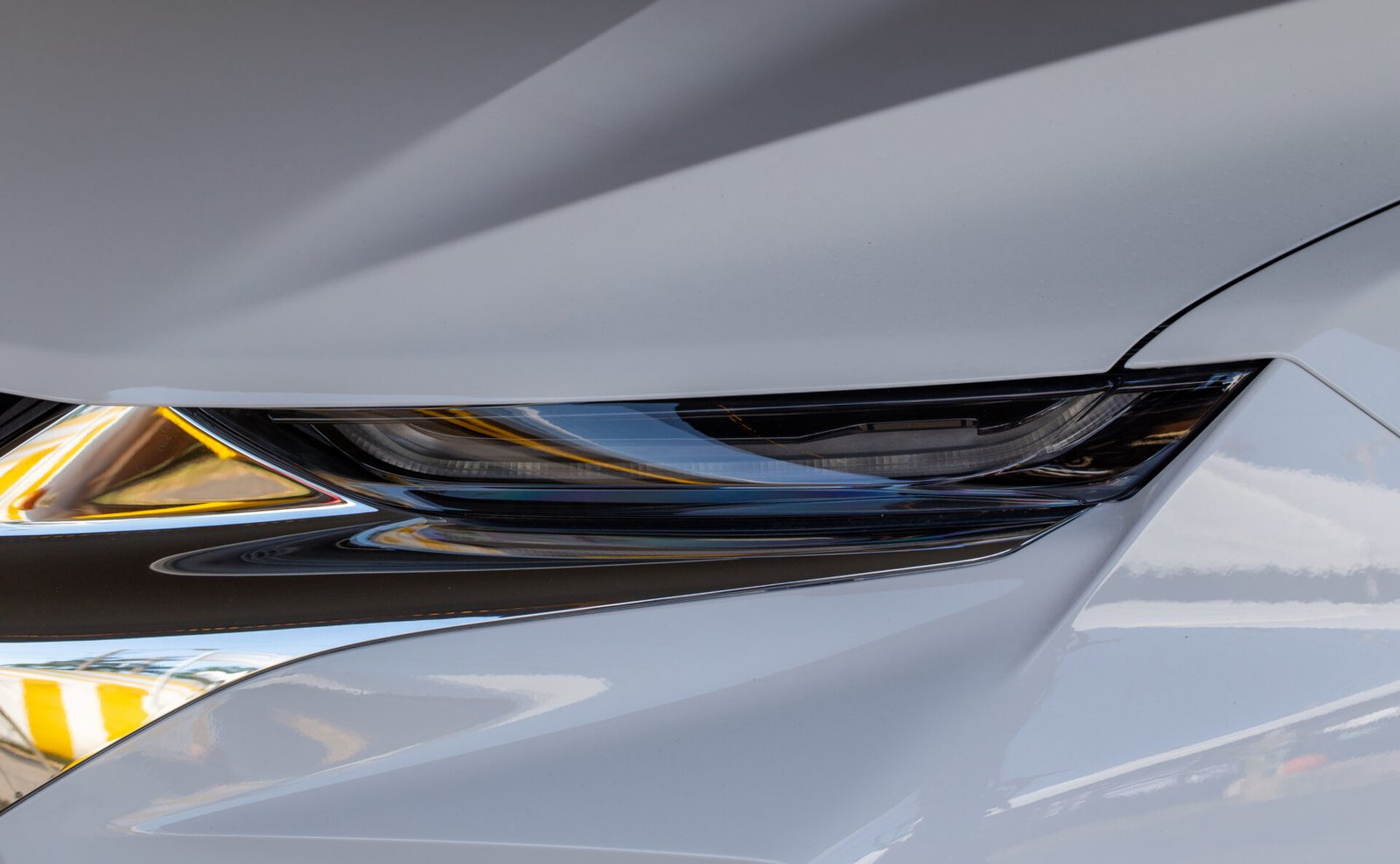 Crystal clear restored headlight on a white car